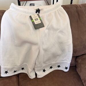 White Shorts with Black Star Accents